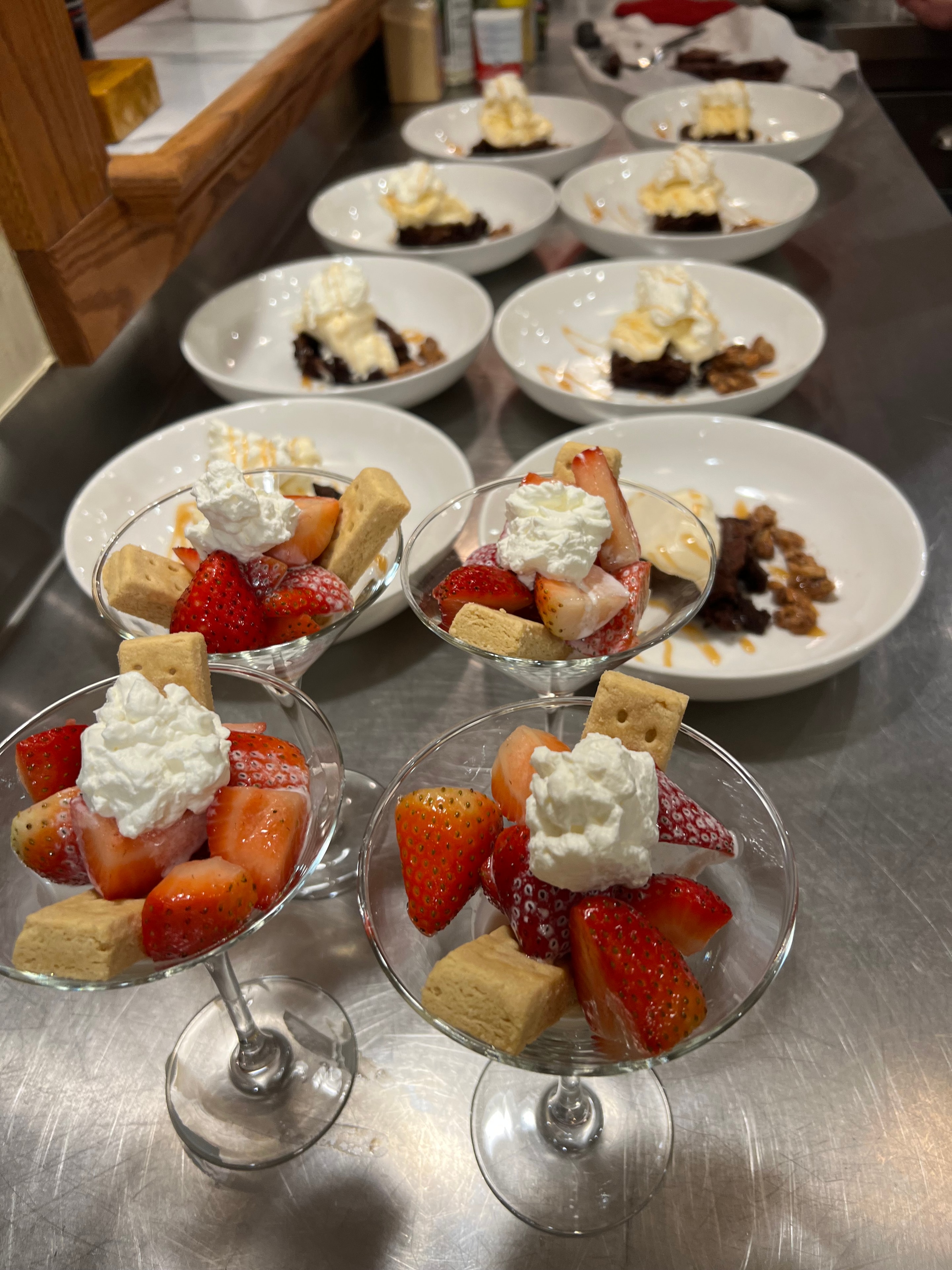 Plated desserts with strawberries and whipped cream