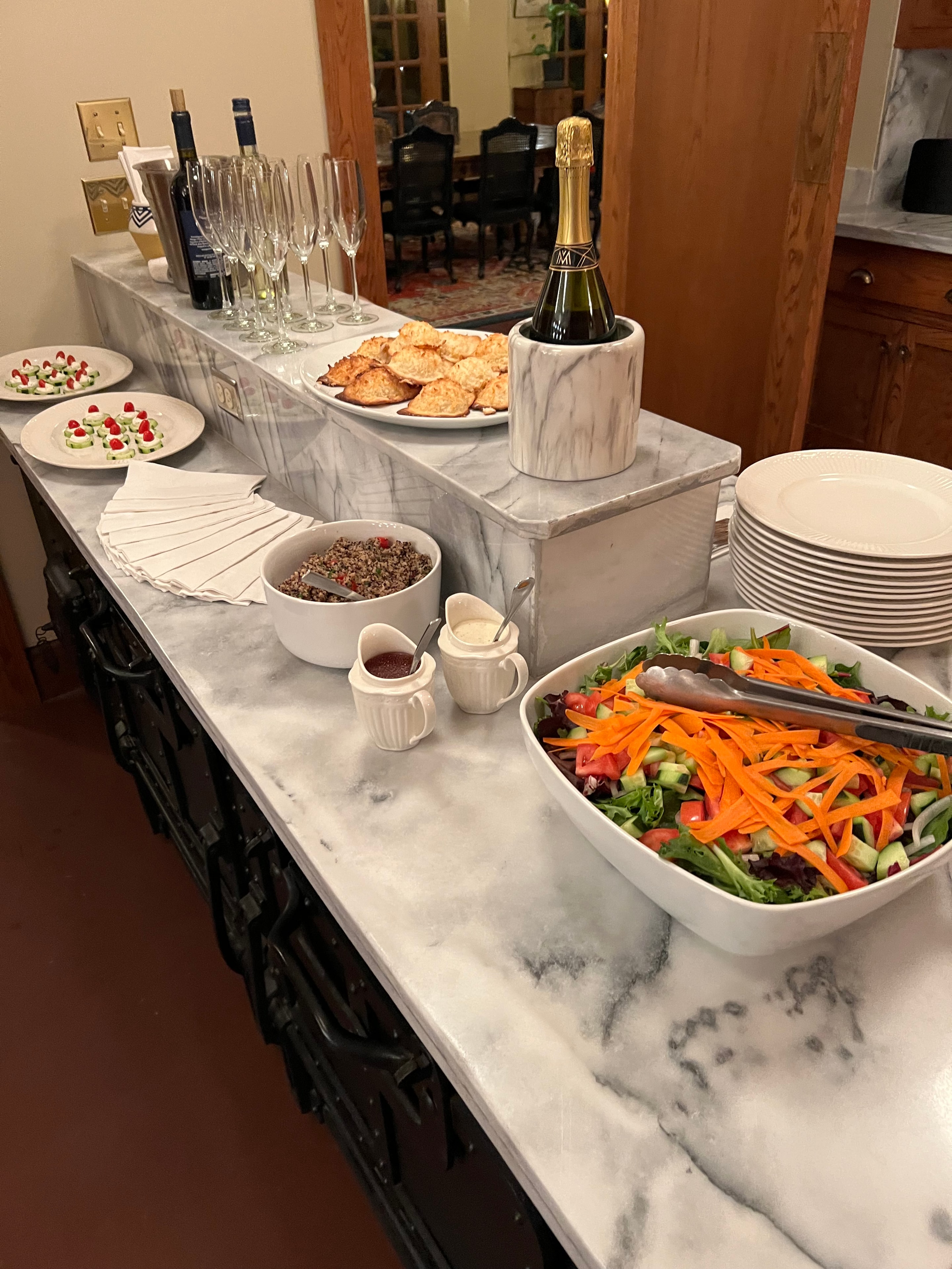 Elegant buffet spread with champagne and appetizers